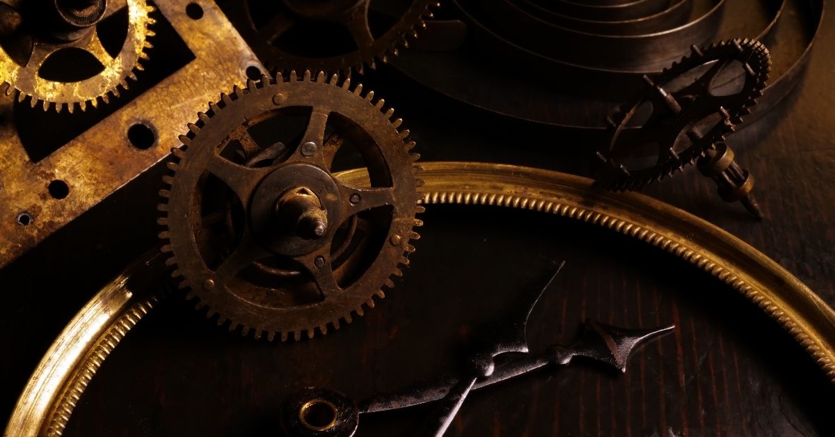 Background from The hands of an old vintage watch, spring and gears.