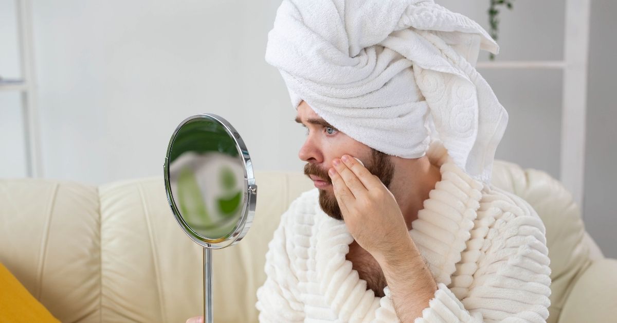 man cleaning skin before shaving