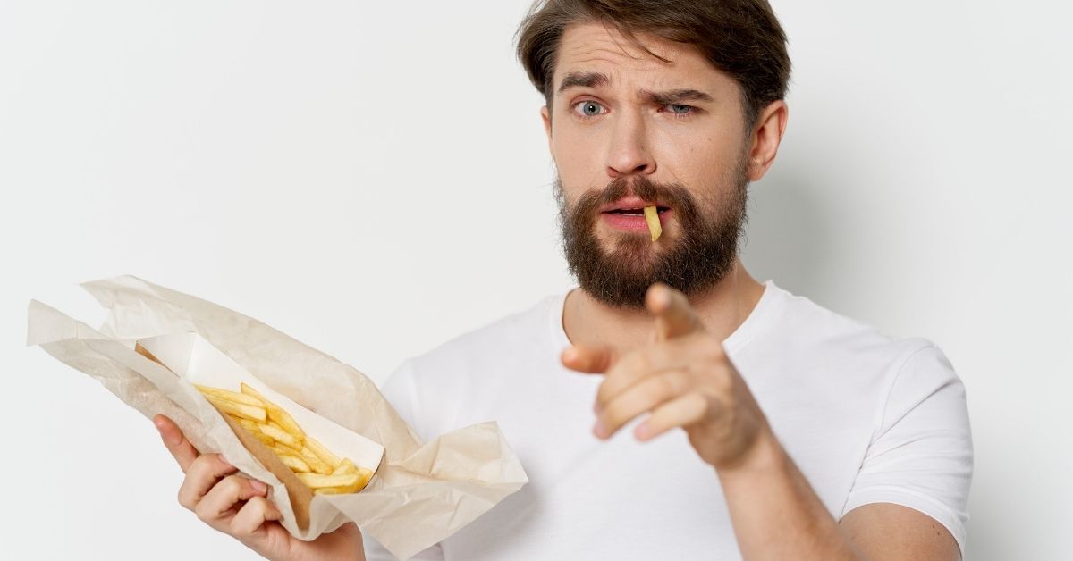 Man Eating With A Beard