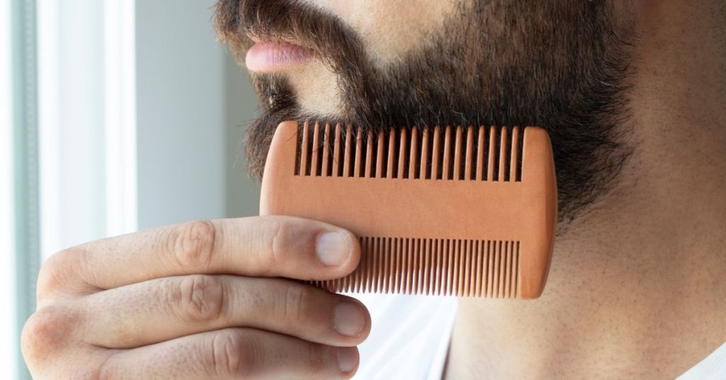 Man combing his beard