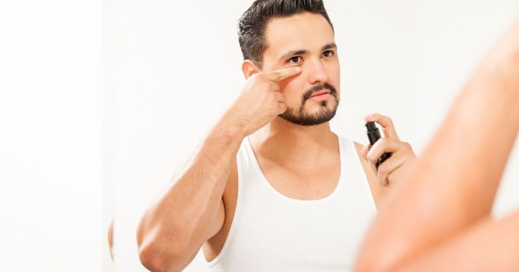 man using anti-aging cream