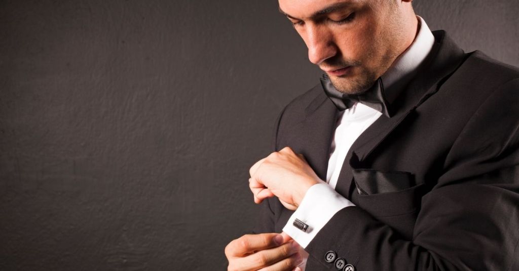 Man adjusting his cufflink
