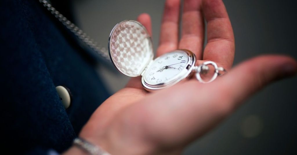Man holding expensive pocket watch