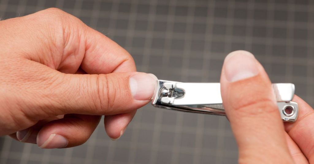 Man cutting his nails