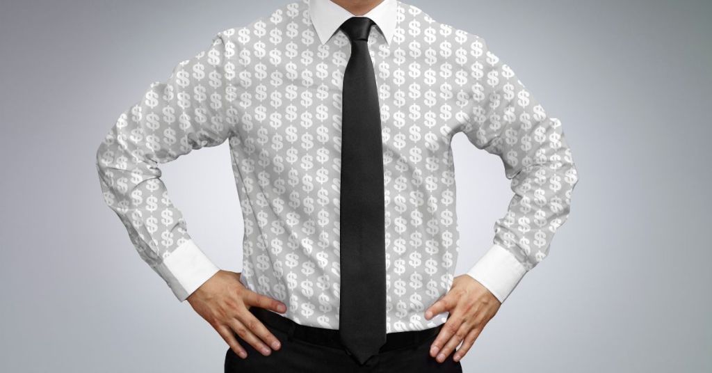 Man wearing patterned dollar shirt