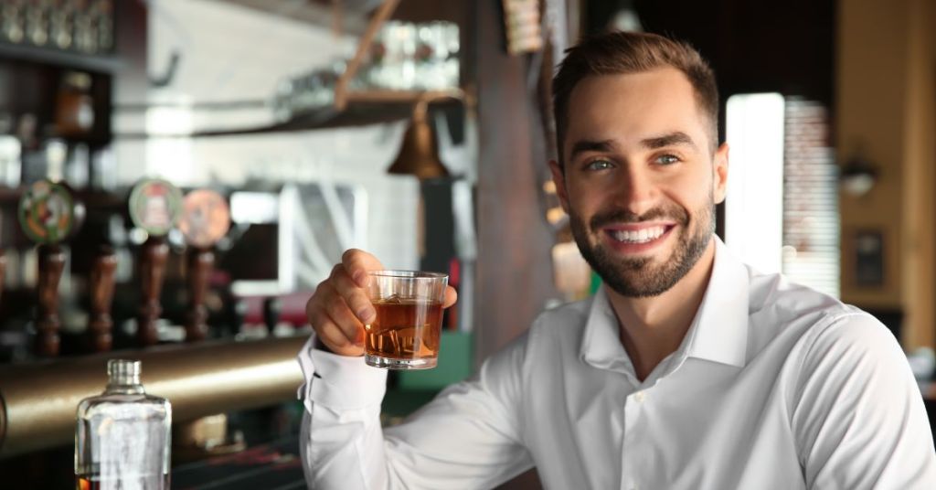 Man drinking bourbon